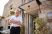 Owner of pub standing proudly at front door