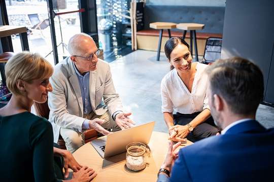 Restaurant owners meeting with business managers to discuss business solutions